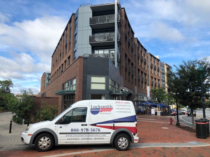 A van parked in front of a building.