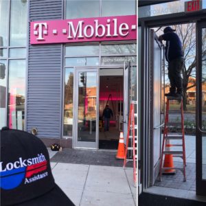 A t-mobile store with a black hat and pink shirt.